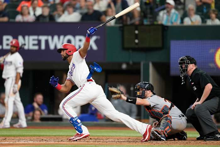 Jun 27, 2023; Arlington, Texas, USA; Texas Rangers pinch hitter Leody Taveras (3) follows through on his RBI single against the Detroit Tigers during the sixth inning at Globe Life Field. Mandatory Credit: Jim Cowsert-USA TODAY Sports